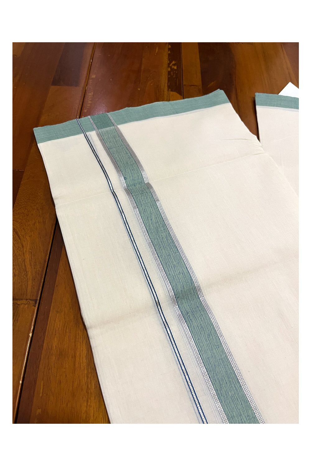 Southloom Premium Unakkupaavu Handloom Mundu with Silver Kasavu and Green Border (South Indian Dhoti)