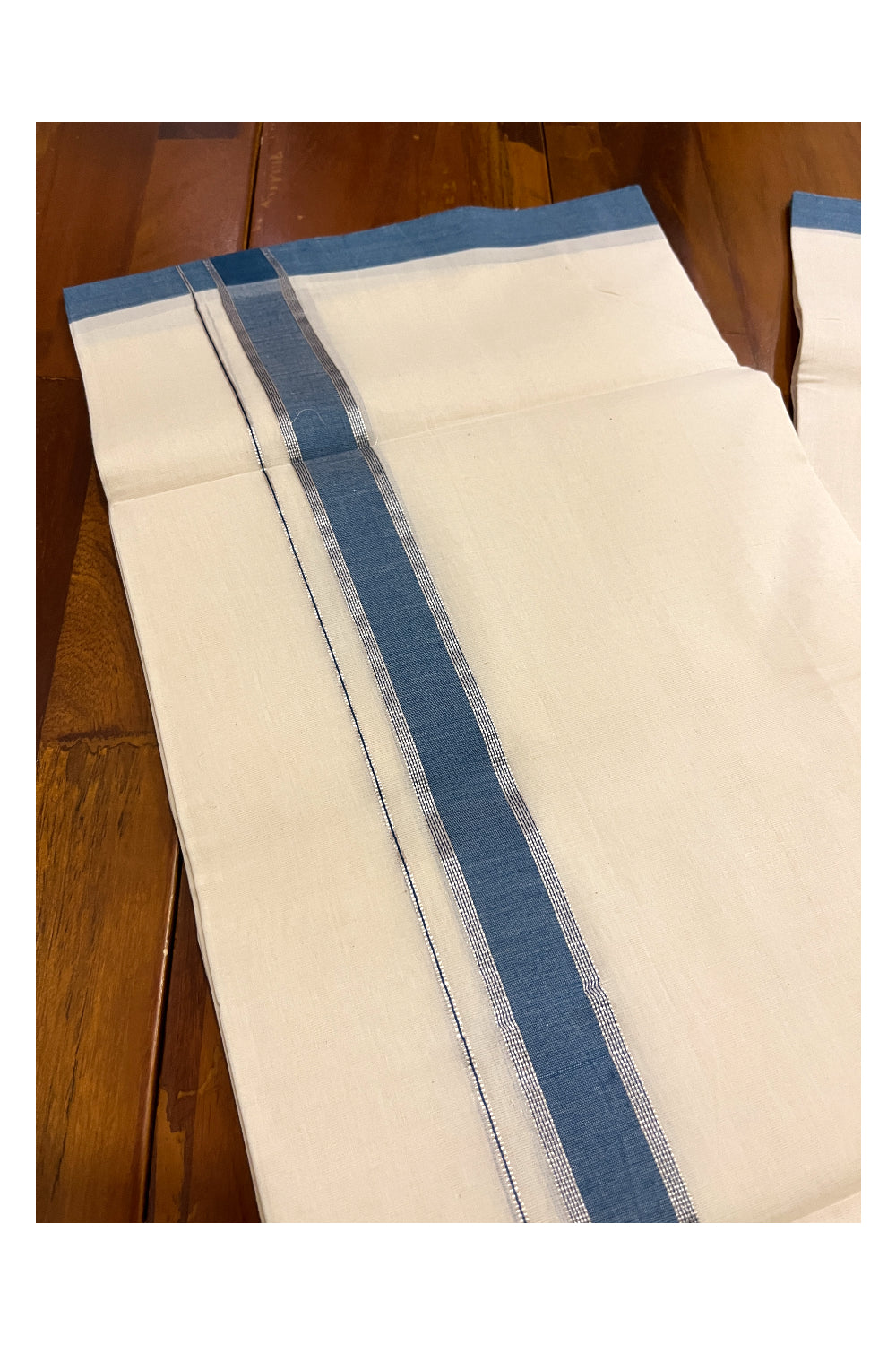 Southloom Premium Unakkupaavu Handloom Mundu with Silver Kasavu and Blue Border (South Indian Dhoti)