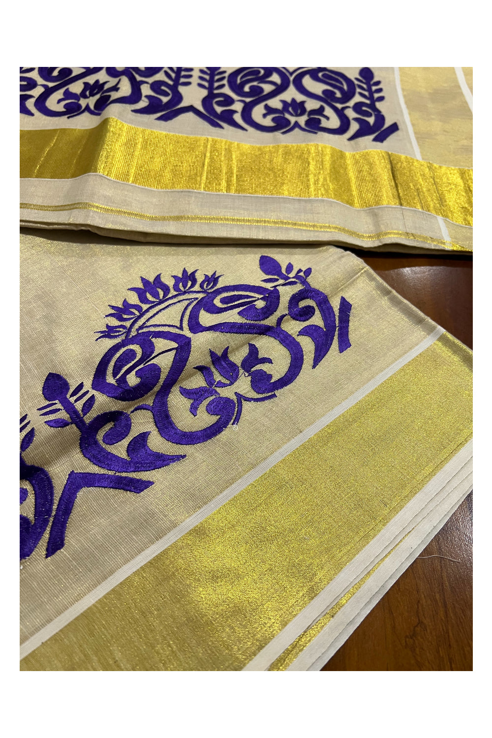 Kerala Tissue Kasavu Saree with Dark Violet Floral Embroidery Design