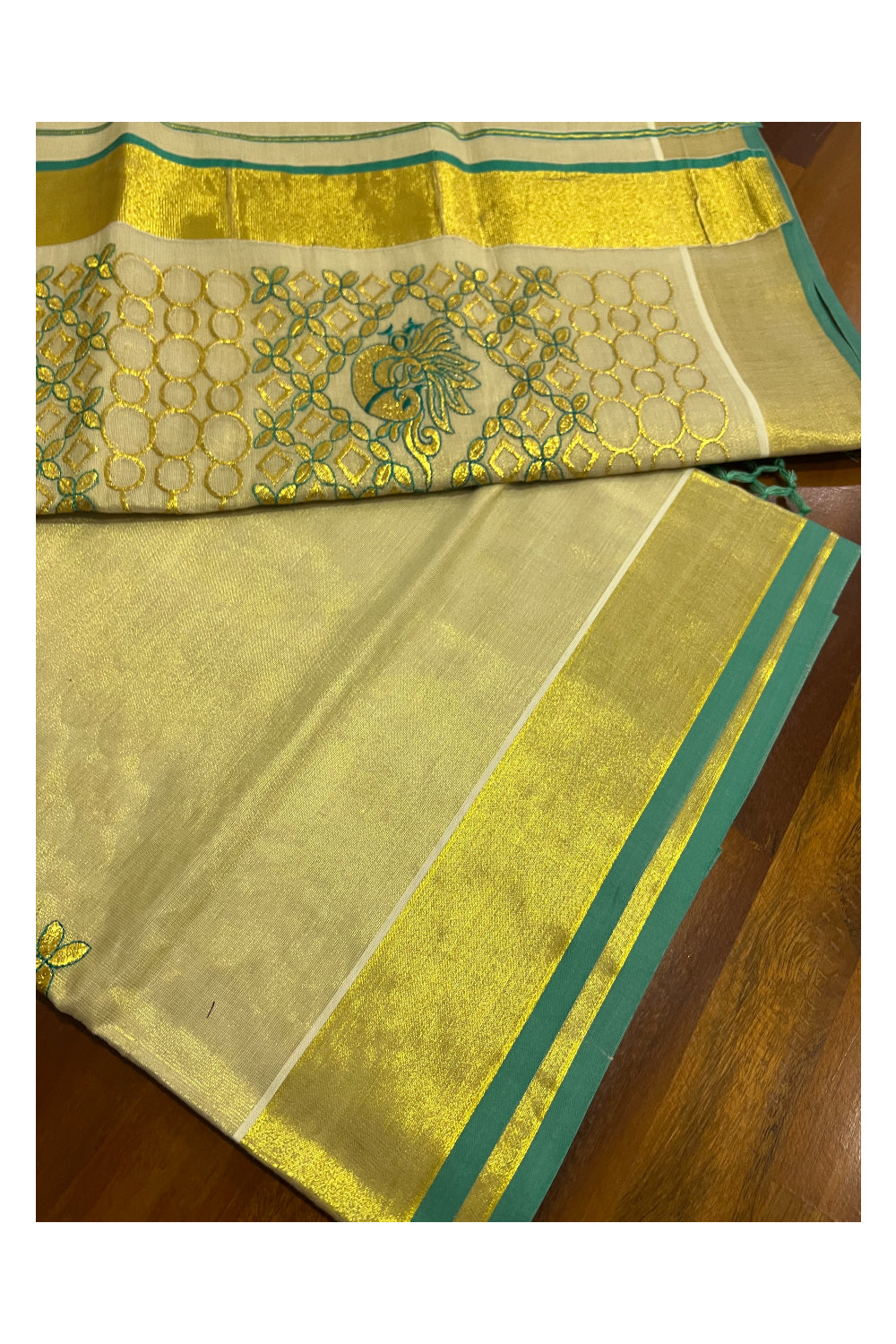 Kerala Tissue Kasavu Heavy Work Saree with Golden and Turquoise Peacock Embroidery Design