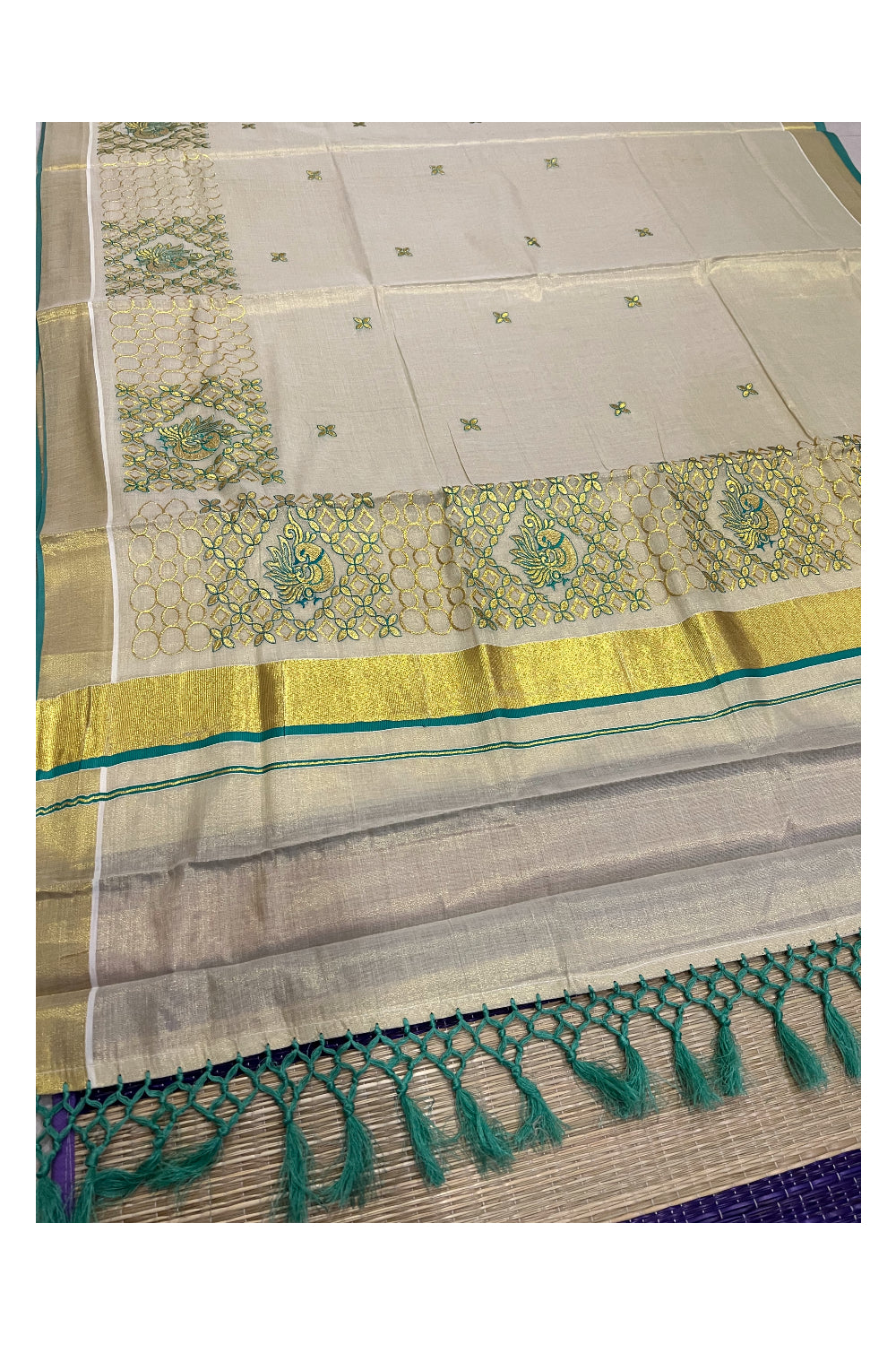 Kerala Tissue Kasavu Heavy Work Saree with Golden and Turquoise Peacock Embroidery Design