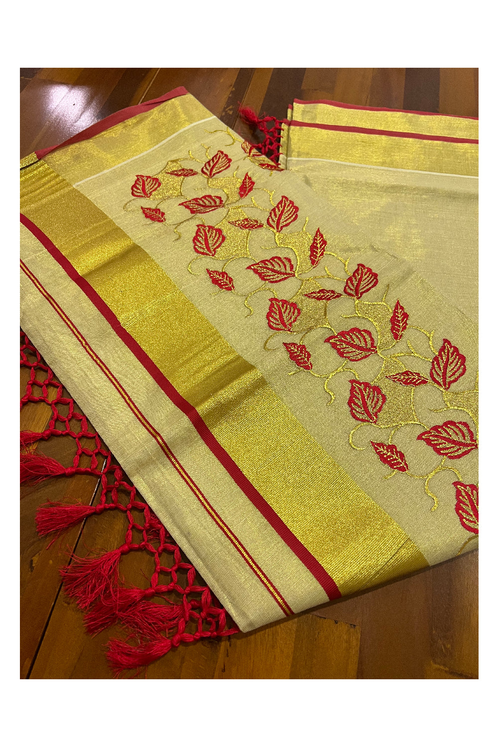 Kerala Tissue Kasavu Heavy Work Saree with Golden and Red Leaf Embroidery Design