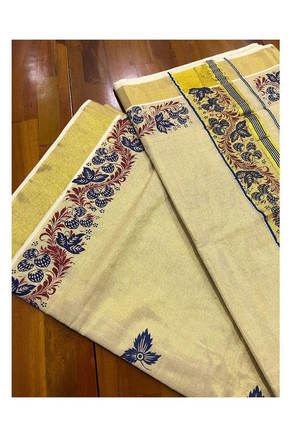 Kerala Tissue Kasavu Saree with Blue and Dark Red Mural Printed Floral Designs