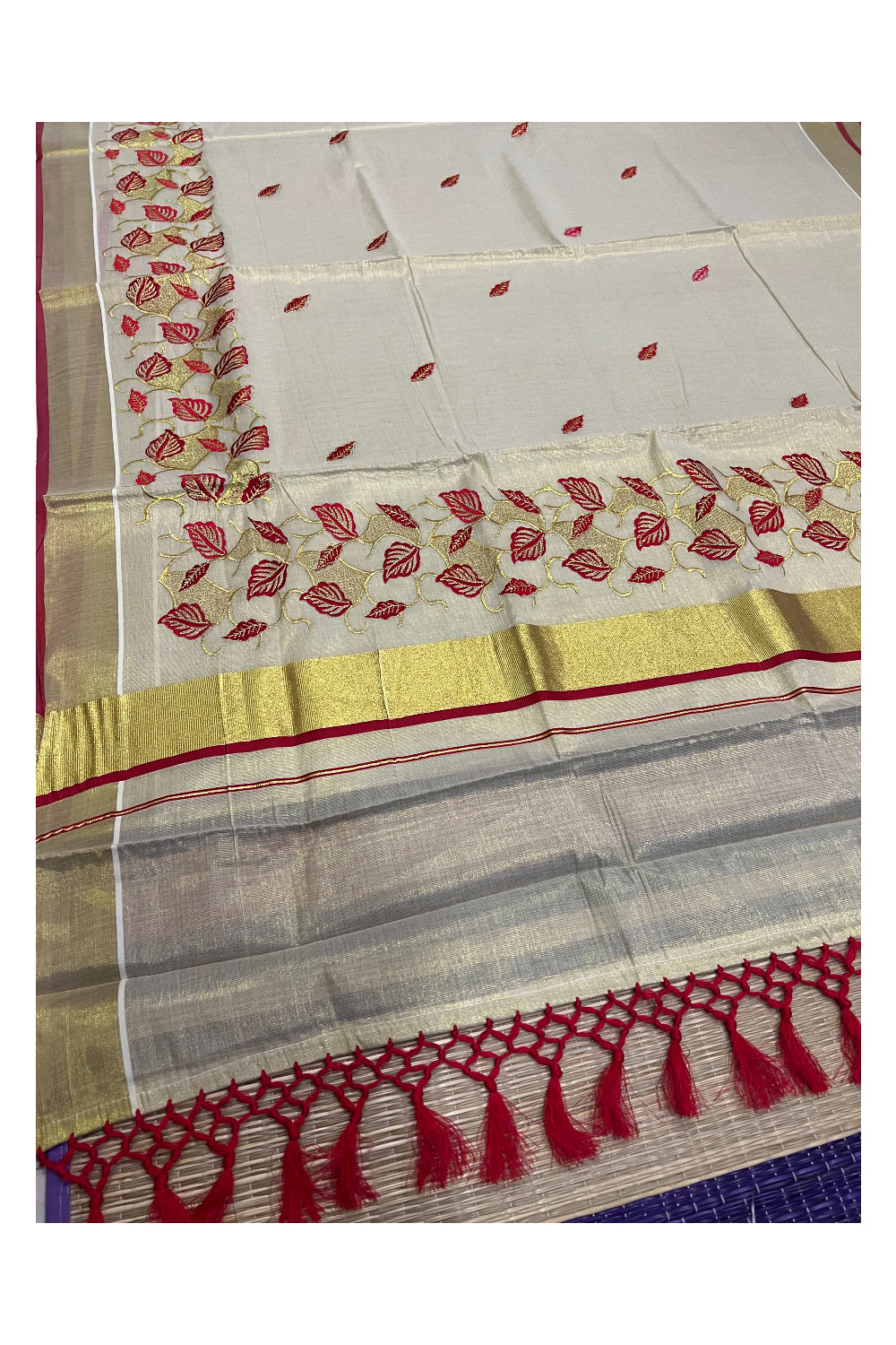 Kerala Tissue Kasavu Heavy Work Saree with Golden and Red Leaf Embroidery Design